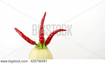 Creative Vegetable Design - Rown Of Hot Chili Peppers On Zucchini Standing Upright, Isolated