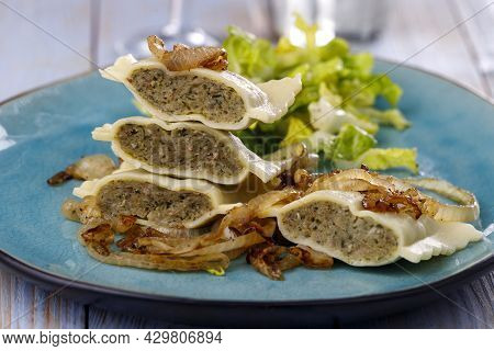 Halves Of Swabian Maultaschen Pasta With Salad