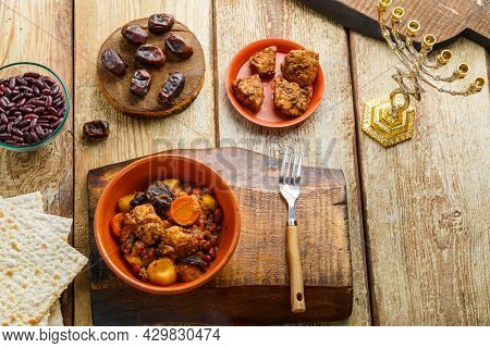 Jewish Dish Shut With Meat On A Wooden Table Near Matzo And Ingredients. Horizontal Photo
