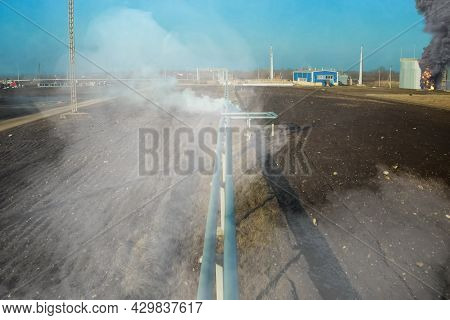 Collage. Fire At The Refinery. Flames And Smoke Of Fire.