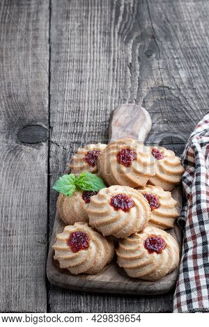 Qurabiya  Cookie Shortbread With Jam On Rustic Wooden Table