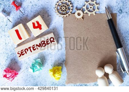 Gift Box And Wooden Calendar With Trendy Blue Numbers, September 14, Business Planner
