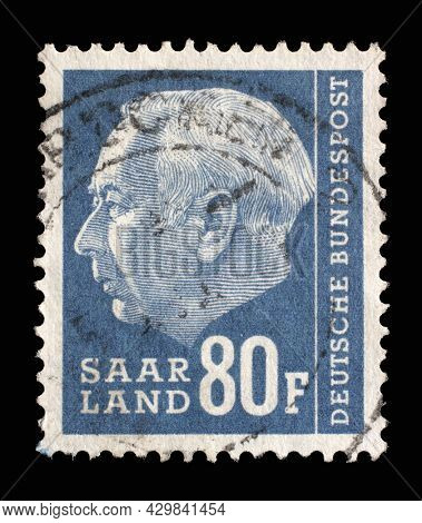 ZAGREB, CROATIA - SEPTEMBER 05, 2014: Stamp from Germany area Saar shows portrait of Theodor Heuss (1884-1963), first President of the Federal Republic of Germany, circa 1957