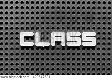 White Alphabet Letter In Word Class On Black Pegboard Background