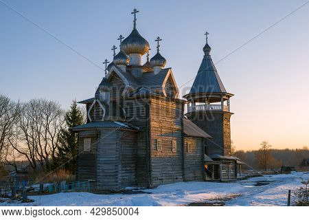 Ancient Wooden Church Of Dmitry Solunsky On April Evening. Shcheleiki Village. Leningrad Region, Rus