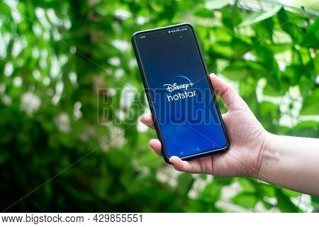 Mobile Phone Smartphone With Popular Ott Streaming App Hotstar Disney Plus In India. Held By Young W
