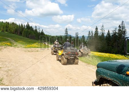 Slavsk. Ukraine. June 20. 2021. Tourists On Atvs On A Mountain Road. Extreme Vacation. Carpathian Mo