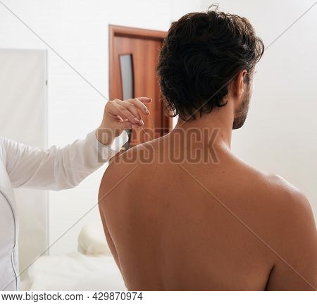 Reflexologists Hand With Acupuncture Needle While Insert Needle Into Special Point On Mans Body Meri