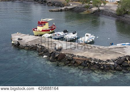 Thirasia Island Greece. Small Islet Near To Santorini.  Small Fishing Boats Moored A The Quiet Harbo