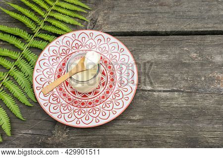 Eco Friendly, Food, Composition With Organic, Vegan, Homemade Yogurt Fern Leave On A Wooden Table Wi