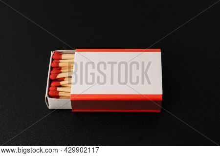 An Open Matchbox With A Blank White Label.