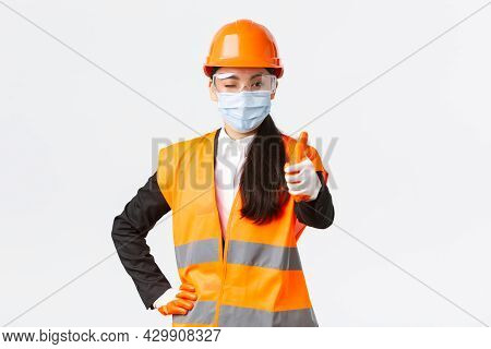 Covid-19 Safety Protocol At Enterpise, Construction And Preventing Virus Concept. Confident Asian Fe