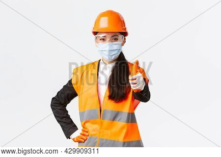 Covid-19 Safety Protocol At Enterpise, Construction And Preventing Virus Concept. Confident Asian Fe