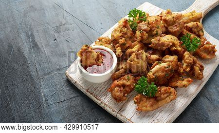 Chicken Pakora Dish With Sweet Chilli Sauce On White Wooden Board