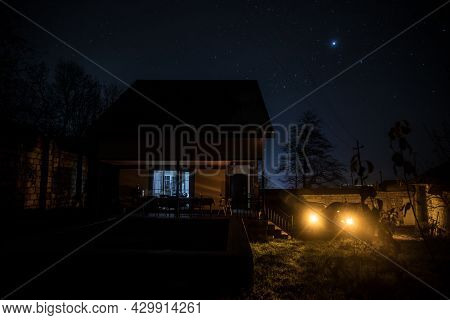 Old House With A Ghost In The Forest At Night Or Abandoned Haunted Horror House In Fog. Old Mystic B