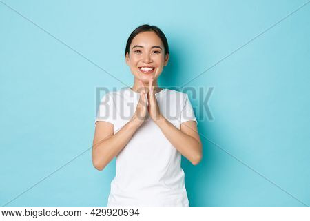 Charming Happy Asian Female In White T-shrit Smiling Satisfied, Clapping Hands, Congratulate Person 