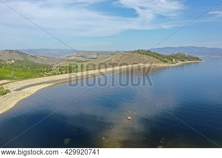 Aerial View Of Lake Granby, Colorado And Surrounding Mountains And Forests On Calm Sunny Summer Morn