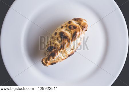 Traditional Argentinian Food Called Empanada In A Restaurant From A Top View