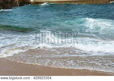 Waves Lapping The Sands Of Ponta Do Humaitá Beach.