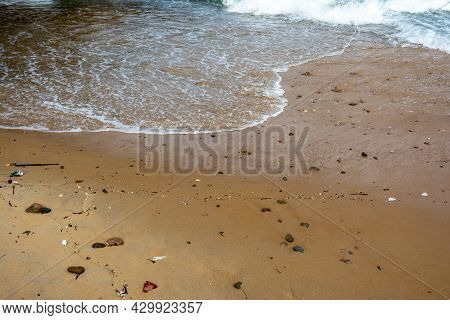 Waves Lapping The Sands Of Ponta Do Humaitá Beach.