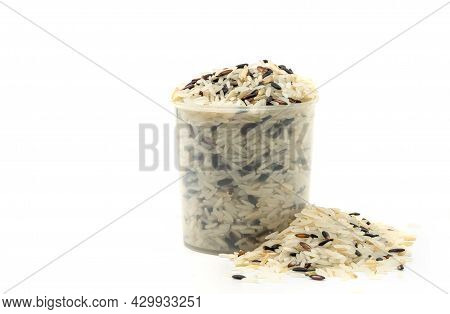 Three Kinds Of Rice In A Plastic Rice Measuring Cup, Small Heap Rice Is Besides, The Image On White