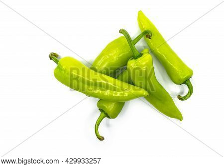 Flat Lay Of Small Heap Fresh Sweet Green Peppers Or Banana Peppers, The Isolated Image On White Back