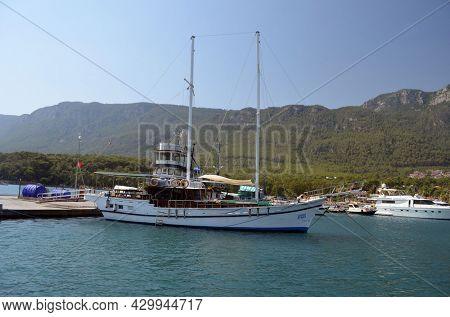 Boats and yachts at the in the marina of village Akyaka - slow city in Turkey.August 1,2021. Mugla,Turkey