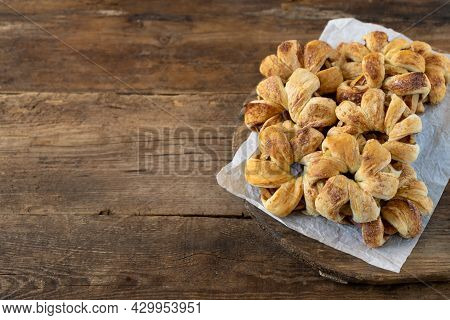 Apple Rings In Dough. Sweet Homemade Cakes. Puff Pastry Pies With Apple Filling. Simple Pie On A Woo