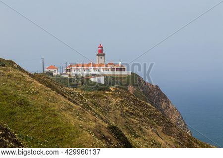 Lighthouse at Cape Roca (Cabo da Roca), most western point of Europe at coast of Atlantic Ocean in Portugal.