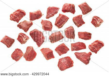 Large Pieces Of Beef Meat On A White Background Of Isolate. Sliced Red Meat Cubes