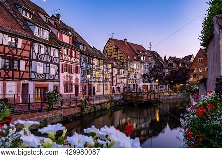 Colmar, Alsace, France. Petite Venice, Water Canal, And Traditional Half Timbered Houses. Colmar Is 
