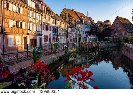Colmar, Alsace, France. Petite Venice, Water Canal, And Traditional Half Timbered Houses. Colmar Is 