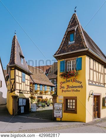 Eguisheim, Alsace, France July 2021, Traditional Colorful Halt-timbered Houses In Eguisheim Old Town