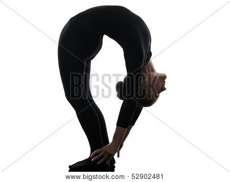 one caucasian woman contortionist practicing gymnastic yoga  in silhouette   on white background