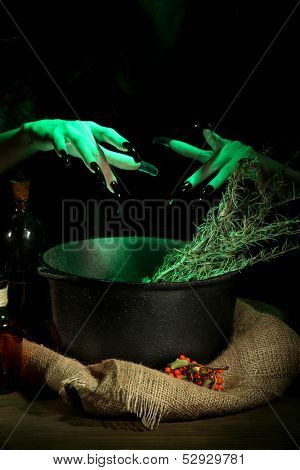  Witch in scary Halloween laboratory on dark color background