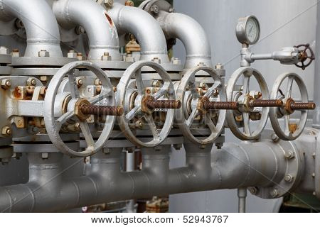 Close-up Of Old Gate Valve On Pipe Connection