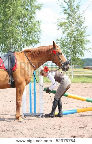 Beautiful Young Blonde Woman Setting The Barrier For Show Jumping