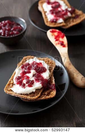 bread with creme fraiche and lingonberry jam 