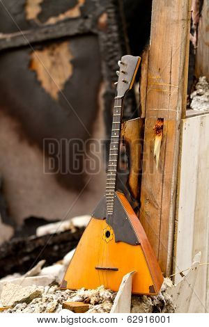 Balalaika On The Ruins Of A Destroyed House