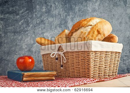 Delicious Bread And Rolls In Wicker Basket