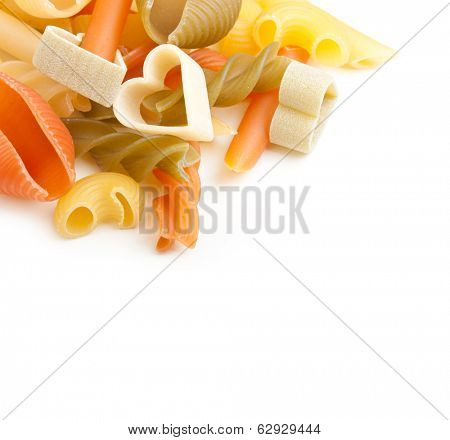 Heap of different type of pasta on white background