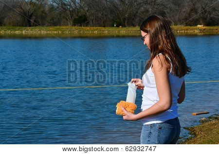 Women with Crackers and bread at the Pond