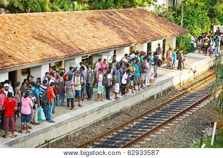 Bentota, Sri Lanka - 28 Apr 2013: People Wait For A Train On Railway Platform In Bentota, Sri Lanka.