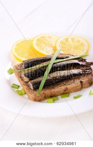 Sprats Sandwich On White Plate