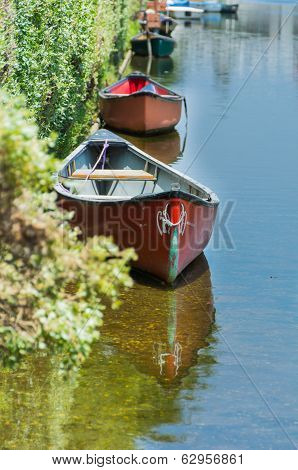 Two red canoes in a Venice Canals in Venice Beach