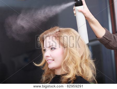 Hairstylist With Hairspray And Female Client Blond Girl In Salon