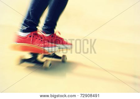 skateboarding woman legs at skatepark