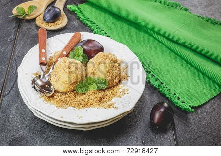 Delicious sweet plum dumplings on plate