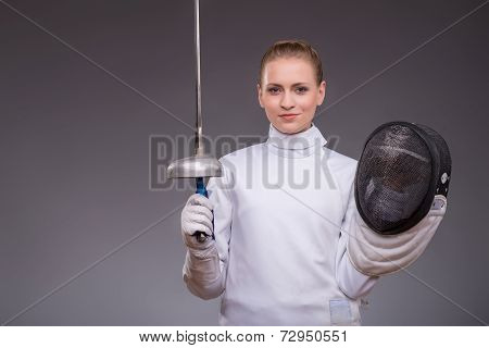 Young woman engaging in fencing