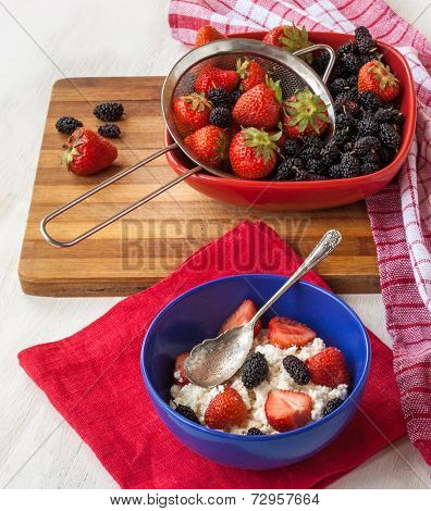 Strawberries With Cream Cheese In Blue Plate On The Kitchen Table